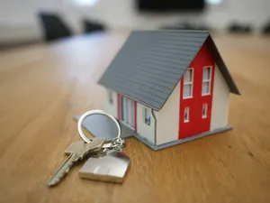 white and red wooden house miniature on brown table jigsaw puzzle