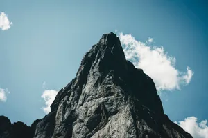 Stunning view of a rocky mountain peak under a clear blue sky in Banff, Alberta. jigsaw puzzle