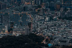 A stunning aerial cityscape of Taipei showcasing urban development and architecture at dusk. jigsaw puzzle