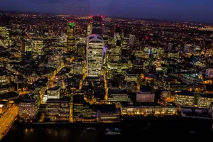A stunning aerial view capturing London's illuminated skyline at night. jigsaw puzzle