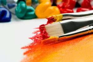 three silver paint brushes on white textile jigsaw puzzle