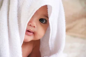 baby doll covered with white towel jigsaw puzzle