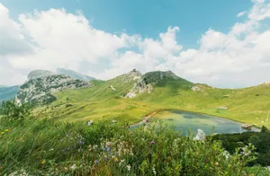body of water on mountain jigsaw puzzle