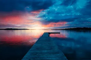 golden hour photography of docking pier on body of water jigsaw puzzle