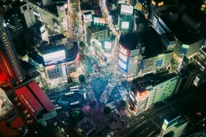 Aerial view of a brightly lit city intersection at night. jigsaw puzzle