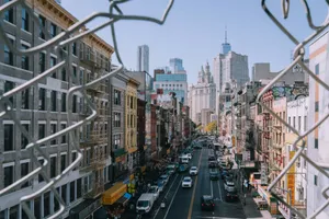 New york city street framed by chain-link fence jigsaw puzzle