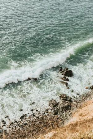 Green ocean waves crashing on a rocky shore. jigsaw puzzle