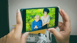 A person holding up a cell phone to take a picture jigsaw puzzle