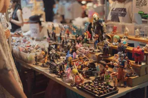 Display table filled with assorted collectible figurines. jigsaw puzzle