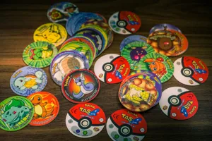 A collection of colorful pokémon pogs and poké ball slammers. jigsaw puzzle