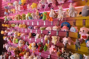 a bunch of stuffed animals are hanging on a wall jigsaw puzzle