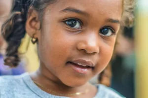 close-up photography of child wearing gray top jigsaw puzzle
