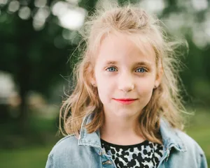 smiling girl in blue denim jacket jigsaw puzzle