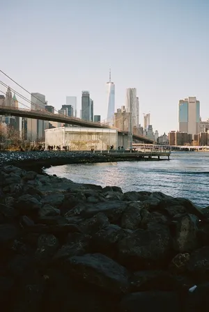 Scenic view of New York City skyline featuring Brooklyn Bridge and waterfront. jigsaw puzzle