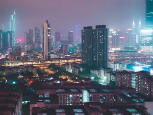 Explore the illuminated skyline of Kuala Lumpur, showcasing iconic skyscrapers and vibrant city lights. jigsaw puzzle