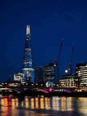 Stunning nighttime cityscape of The Shard and London skyline with reflections in the Thames. jigsaw puzzle