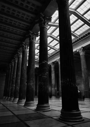Dramatic black and white photo of a classical hall with tall pillars and intricate ceiling details. jigsaw puzzle
