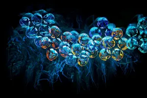 Colorful abstract neon jellyfish-like shapes with a futuristic and illuminated fractal design on a black background. jigsaw puzzle