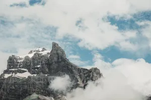 Captivating view of rugged mountain peaks surrounded by clouds in Sixt-Fer-à-Cheval, France. jigsaw puzzle
