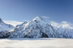 Breathtaking view of snow-covered mountains under a clear sky in Les Deux Alpes, France. jigsaw puzzle