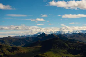 Majestic alpine mountains with snow peaks under a clear blue sky, perfect for travel inspiration. jigsaw puzzle