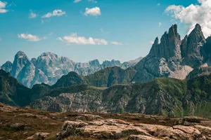 Captivating view of the rugged Dolomite peaks against a vibrant blue sky, perfect for nature lovers. jigsaw puzzle