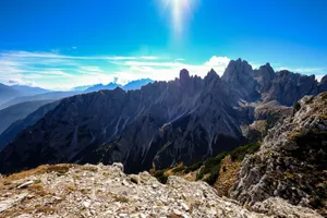 Breathtaking view of the Dolomites mountain peaks under a clear blue sky, perfect for adventure and nature enthusiasts. jigsaw puzzle