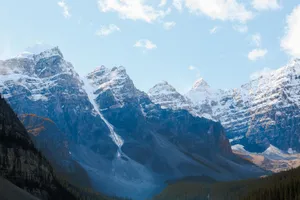 Stunning view of snow-capped Rocky Mountains under a clear blue sky in winter. jigsaw puzzle
