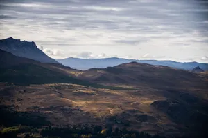 Explore the breathtaking wide-angle view of Esquel's mountainous Patagonian landscape in Chubut, Argentina. jigsaw puzzle