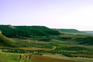 Breathtaking view of rural hills and fields near Madrid, Spain, showcasing lush greenery. jigsaw puzzle