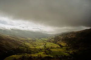 Scenic aerial of lush valleys under dramatic skies in England's Lake District. jigsaw puzzle