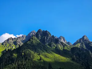 Breathtaking view of Vorarlberg's Rätikon mountains under clear summer skies. jigsaw puzzle