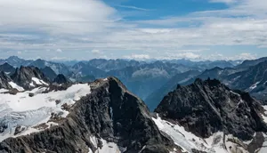 Breathtaking aerial view of the snow-capped peaks of the Swiss Alps, captured in the summer. jigsaw puzzle