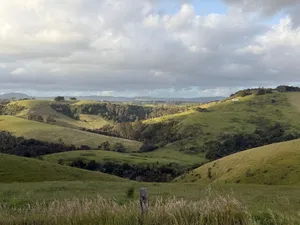Breathtaking view of lush rolling hills and cloudy skies in Victoria, Australia. jigsaw puzzle