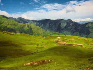 Breathtaking view of lush green hills and mountains in Haveli Azad Kashmir, perfect for a nature escape. jigsaw puzzle