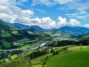Breathtaking aerial shot of lush green valleys and mountains in the Austrian Alps. jigsaw puzzle