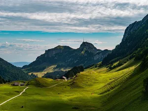 Breathtaking view of lush green valleys and mountains in Sennwald, Switzerland. jigsaw puzzle