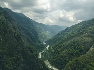 Breathtaking view of lush mountainous valley and river in Ghandruk, perfect for nature lovers and trekkers. jigsaw puzzle