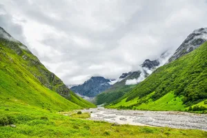 Scenic view of lush green valley with mountains in Uttarakhand, India. jigsaw puzzle