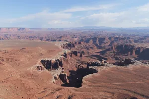 Stunning aerial view of the vast and rugged landscape of Canyonlands National Park, featuring dramatic rock formations. jigsaw puzzle