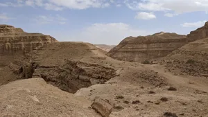 Explore the captivating beauty of a rugged desert landscape under a clear sky. jigsaw puzzle