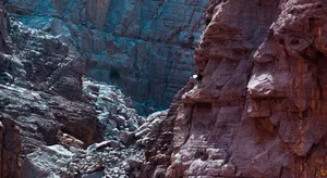 Explore the vivid red and blue hues of these captivating desert rock formations. jigsaw puzzle