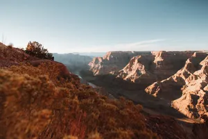 Stunning sunrise view of the Grand Canyon, showcasing its vast, rugged landscape and natural beauty. jigsaw puzzle