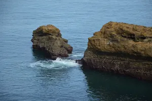 Natural rock formations eroded by the sea along a serene coastal edge. jigsaw puzzle