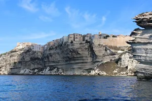 Scenic view of Bonifacio, Corsica, with buildings perched atop dramatic cliffs by the sea. Perfect for travel enthusiasts. jigsaw puzzle