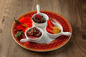 Delicious gourmet desserts served in bowls with strawberries and a red flower for garnish. jigsaw puzzle