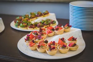 Elegant display of gourmet mini desserts with strawberries, perfect for upscale dining settings. jigsaw puzzle