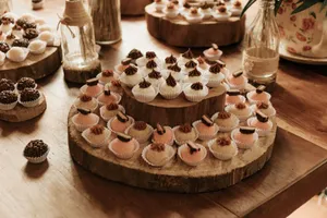 A variety of arranged sweet truffles in a rustic setting on wooden trays. Perfect for dessert enthusiasts. jigsaw puzzle
