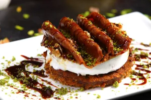 Close-up of a delicious Middle Eastern dessert featuring ice cream and pistachios. jigsaw puzzle