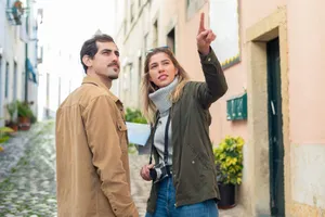 Young couple navigating a European street with a map, showcasing travel adventure. jigsaw puzzle